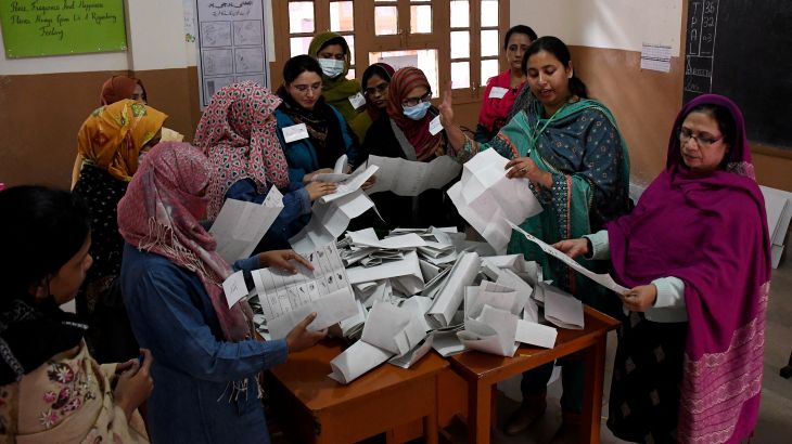 Polling staff count ballots after the end of the voting