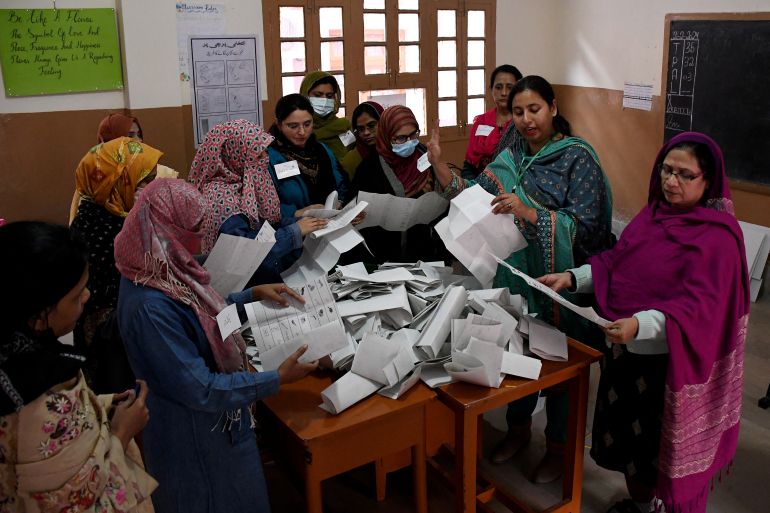 Polling staff count ballots after the end of the voting