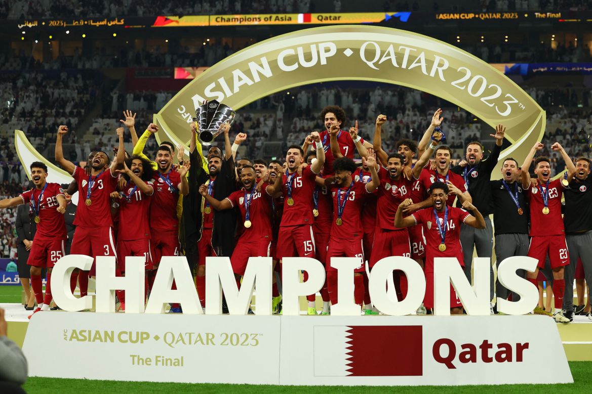 Qatar players lift the trophy