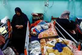 A Palestinian child lies on a bed at Abu Youssef al-Najjar Hospital, while Gaza residents face crisis levels of hunger and soaring malnutrition, in Rafah in the southern Gaza Strip [File: Ibraheem Abu Mustafa/Reuters]