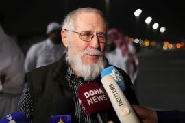 Austrian national Herbert Fritz speaks to the media after disembarking from a plane, in Doha, Qatar [Arafat Barbakh/Reuters]