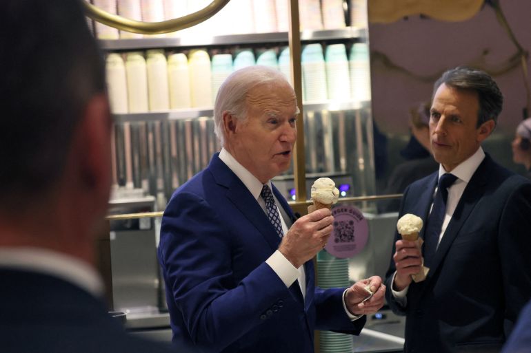 U.S. President Joe Biden answers a question from a member of the news media as he and Seth Meyers visit Van Leeuwen Ice Cream in downtown New York