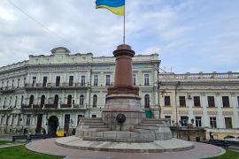 A Ukrainian flag has replaced the statue of Russian empress Catherine the Great in central Odesa, Ukraine [Mansur Mirovalev/Al Jazeera]
