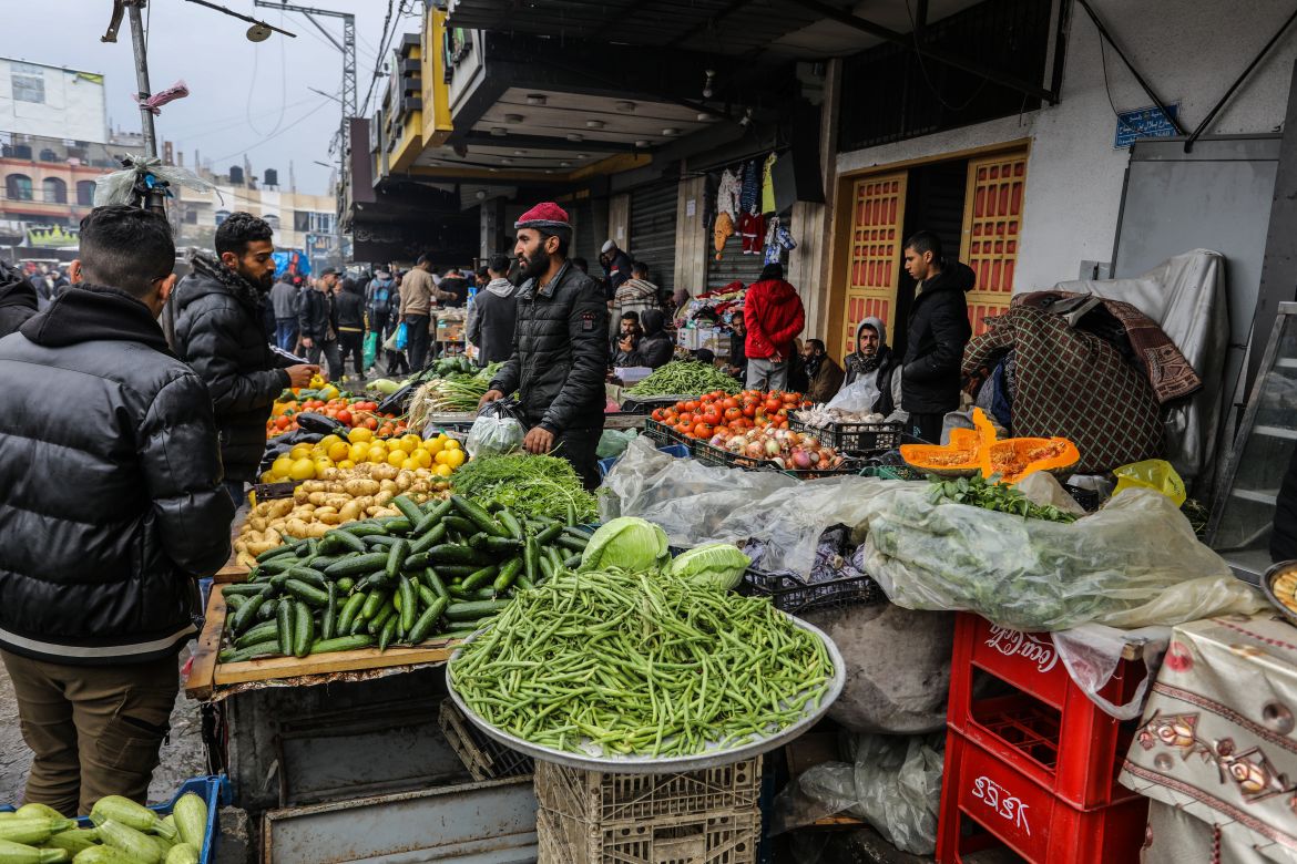 Palestinians flock to bazaars to meet their needs during rainy day as they try to continue their daily life amid Israeli attacks in Rafah, Gaza on February 18
