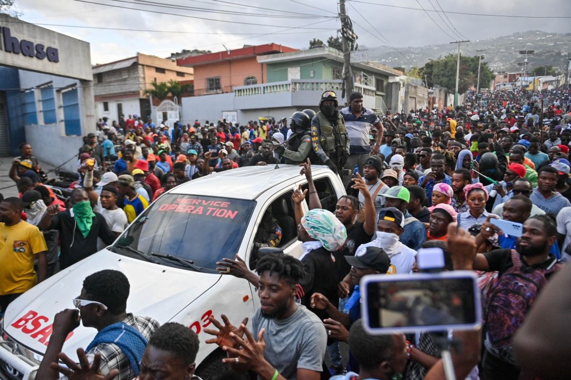 People celebrate the arrival of the para-military and environtmental agency Protected Areas Security Brigade (BSAP)