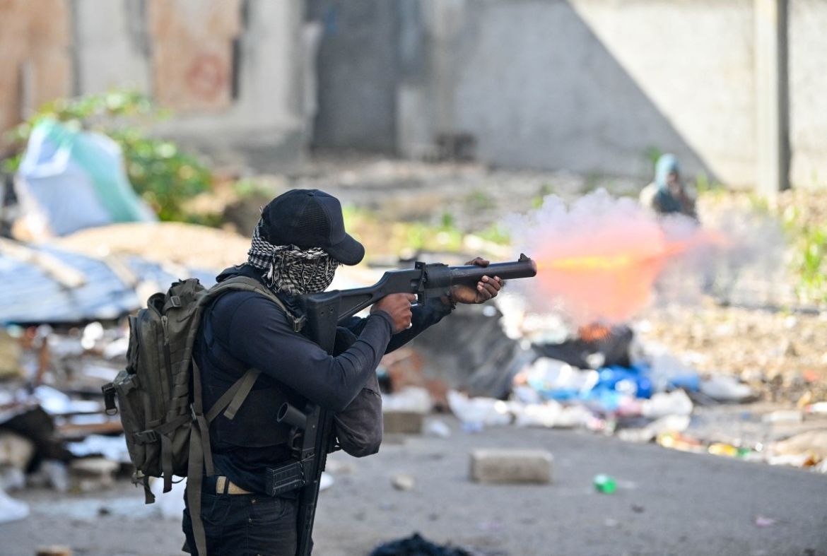 A policeman shoots teargas