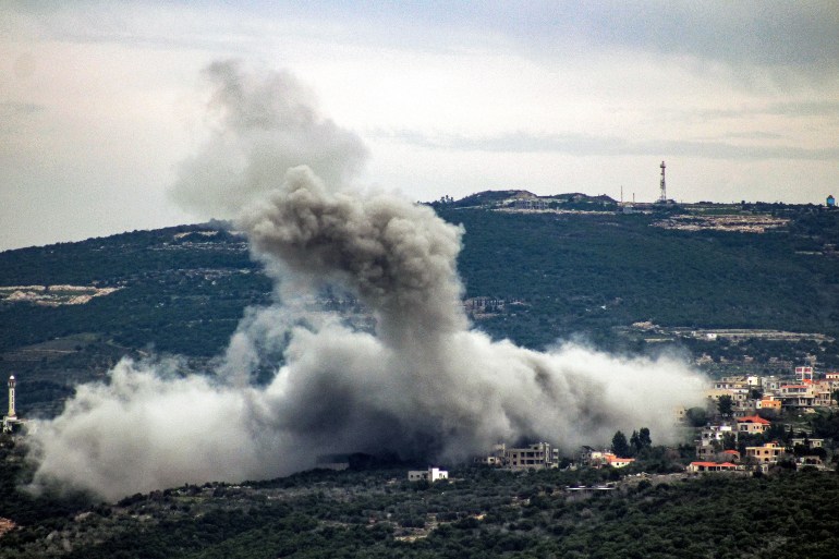 Smoke billows following Israeli bombardment in the village of Shihin in southern Lebanon near the border with Israel