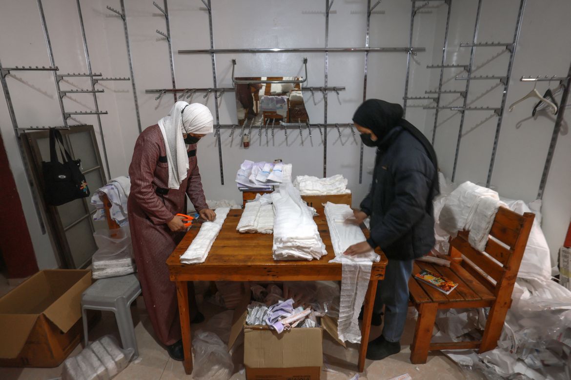 Palestinian women sew diapers at a workshop in Rafah in the southern Gaza Strip, on February 18