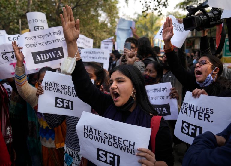 Activists of various left organizations shout slogans during a protest against hate speech in New Delhi