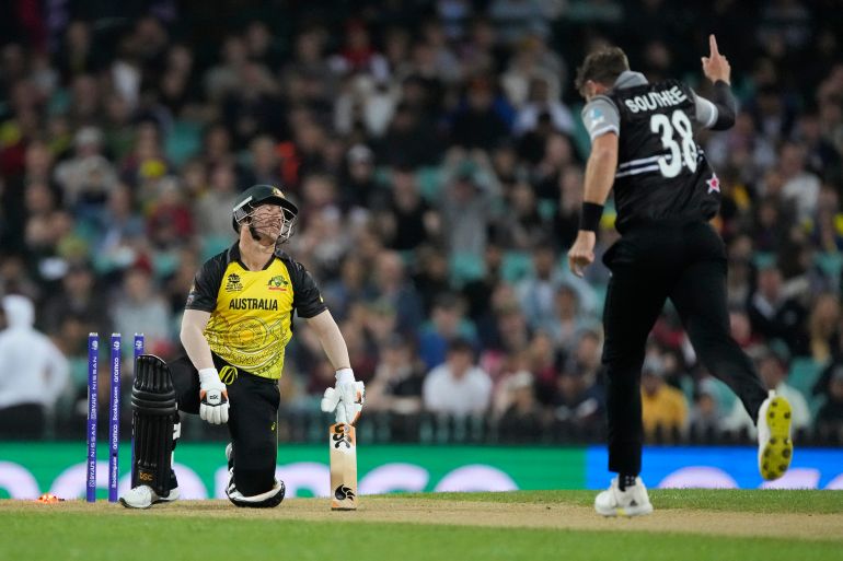 Australia's David Warner reacts after he was out bowled by New Zealand's Tim Southee