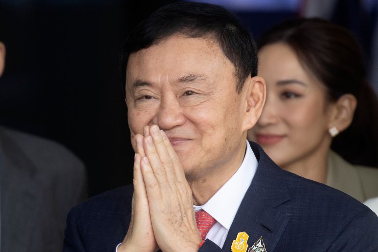 Thaksin Shinwatra, He has his hands together in a Thai greeting