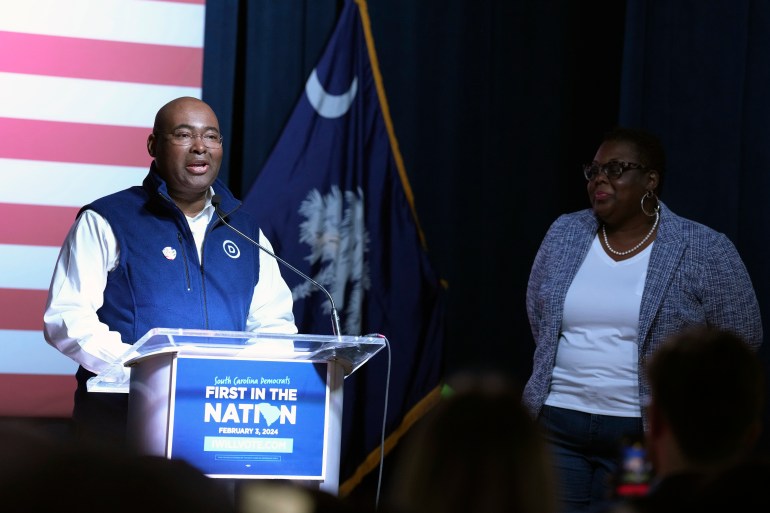 Democratic National Committee Chairman Jaime Harrison, left, addresses attendees at a results watch party following South Carolina's leadoff Democratic presidential primary, Saturday, Feb. 3, 2024, in Columbia, S.C. Harrison says his home state's No. 1 position on the party's primary calendar shows President Joe Biden's commitment to Black voters' interests. (AP Photo/Meg Kinnard)