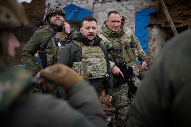 Zelenskyy with troops at the front line