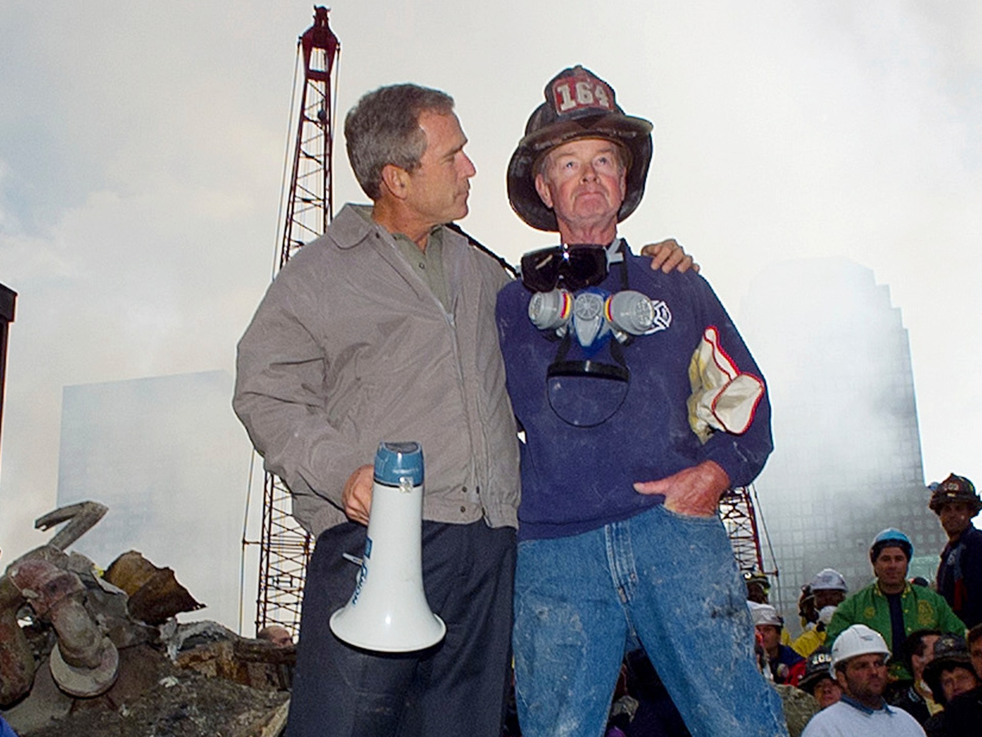 9/11 firefighter who stood next to Bush in famous images dies | News