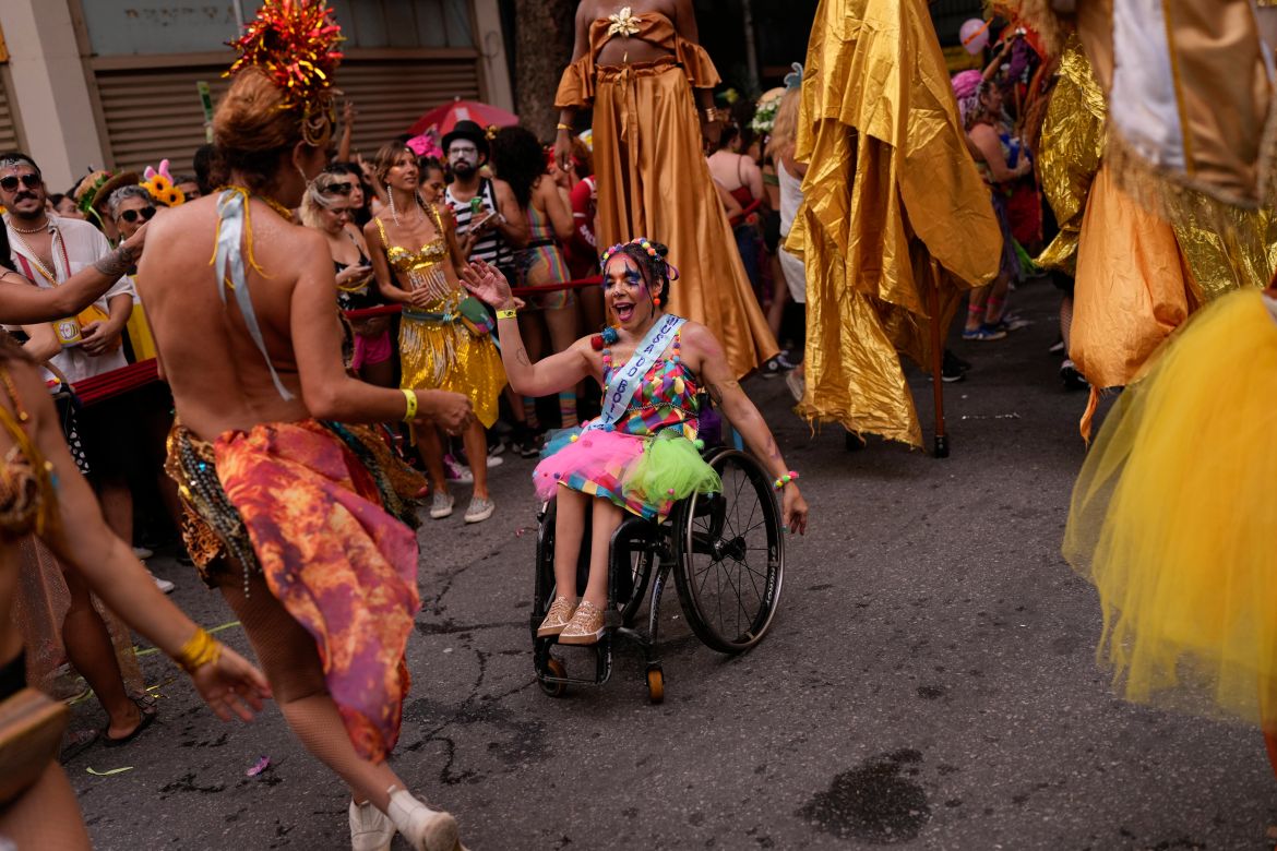 Revelers dance in the "Cordao do Boitata" street pre-carnival party in Rio de Janeiro
