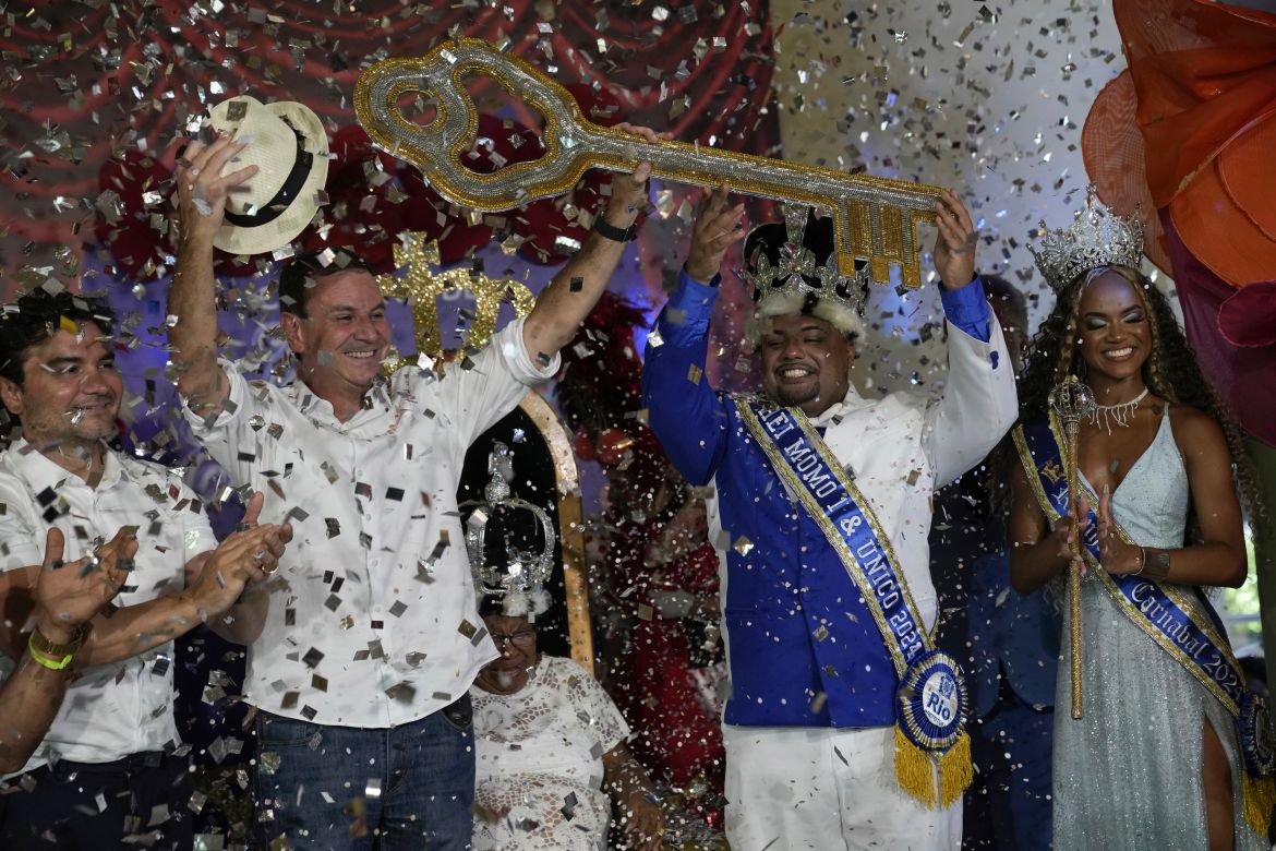 Carnival King Momo, Caio Cesar Dutra, center right, receives the keys of the city from Mayor Eduardo Paes at a ceremony that officially kicks off Carnival in Rio de Janeiro, Brazil, Friday, Feb. 9