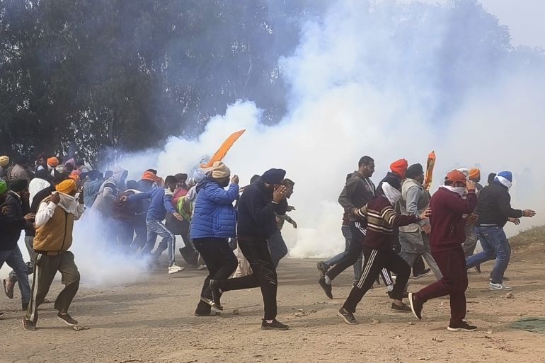 Farmers run for cover after police fired tear gas