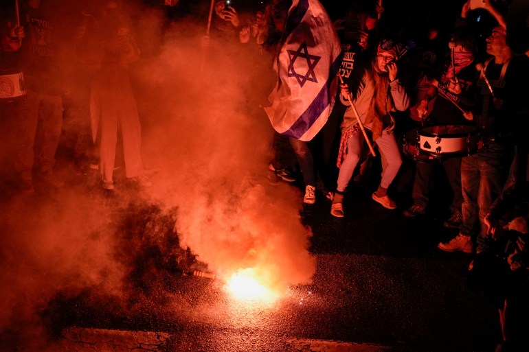 Demonstrators protest against Israeli Prime Minister Benjamin Netanyahu and call for new elections in the latest weekly protest against his handling of the Israel-Hamas war, in Tel Aviv, Israel, Saturday, Feb. 17, 2024.(AP Photo/Leo Correa)