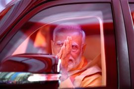 Indian Prime Minister Narendra Modi greets as he returns back after ground breaking ceremony 4.0 of global investors summit in Lucknow, capital of northern Indian state of Uttar Pradesh, Monday, Feb.. 19, 2024. (AP Photo/Rajesh Kumar Singh)