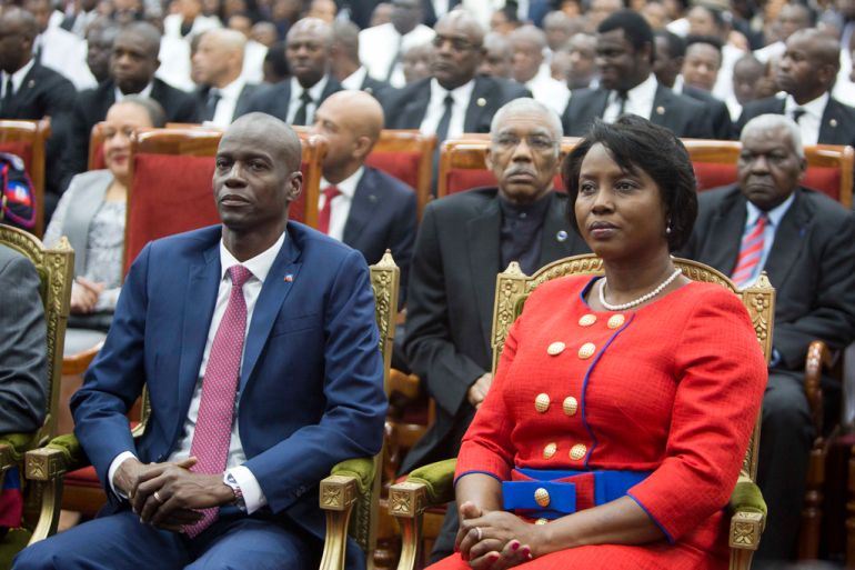 Haiti's assassinated former president Jovenel Moise sits with his wife Martine during his swearing-in ceremony at Parliament in Port-au-Prince, Haiti, Tuesday Feb. 7, 2017