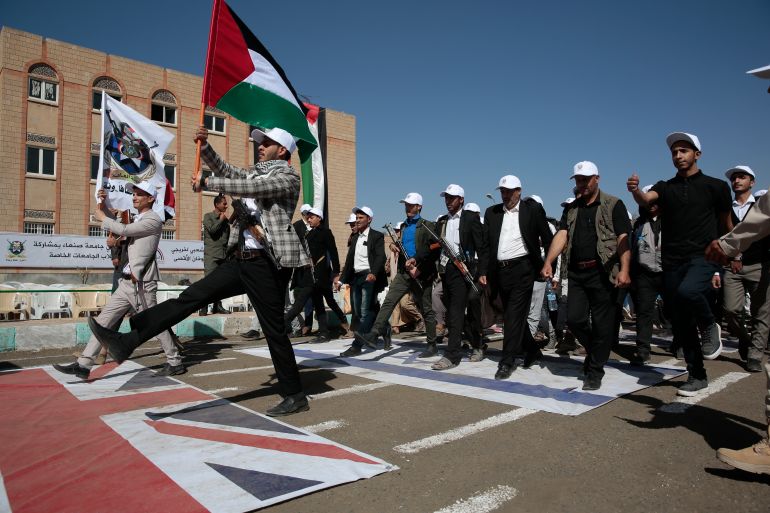 Newly recruited Houthi fighters attend a protest march against the U.S.-led strikes on Yemen and the Israeli war in the Gaza Strip, Wednesday, Feb. 21, 2024, in Sanaa, Yemen. (AP Photo/Osamah Abdulrahman)