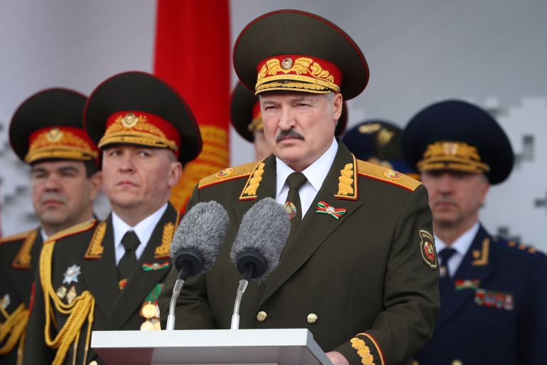 FILE - Belarusian President Alexander Lukashenko, center, gives a speech during a military parade that marked the 75th anniversary of the allied victory over Nazi Germany, in Minsk, Belarus, on May 9, 2020. Belarusians will cast ballots Sunday in tightly controlled parliamentary and local elections that are set to cement an authoritarian leader's rule, despite calls for a boycott by an opposition leader who described the balloting as a "senseless farce." (Belarusian Presidential Press Service via AP, File)