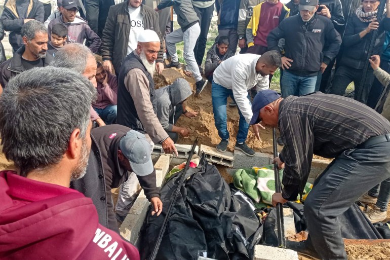 Abu Jawad, Gaza gravediggerAbu-Jawad organising a mass grave after a massacre in Deir al-Balah-