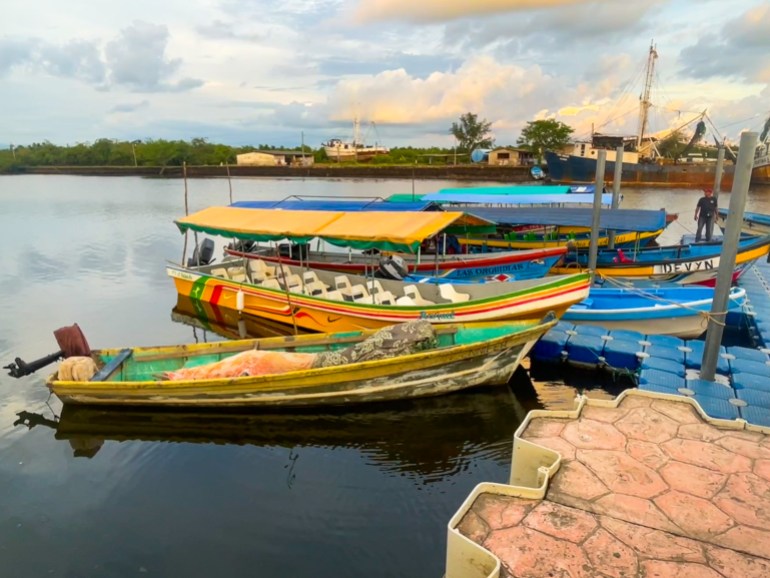 Colorful wooden boats parked at a dock in Puerto El Triunfo, El Salvador.