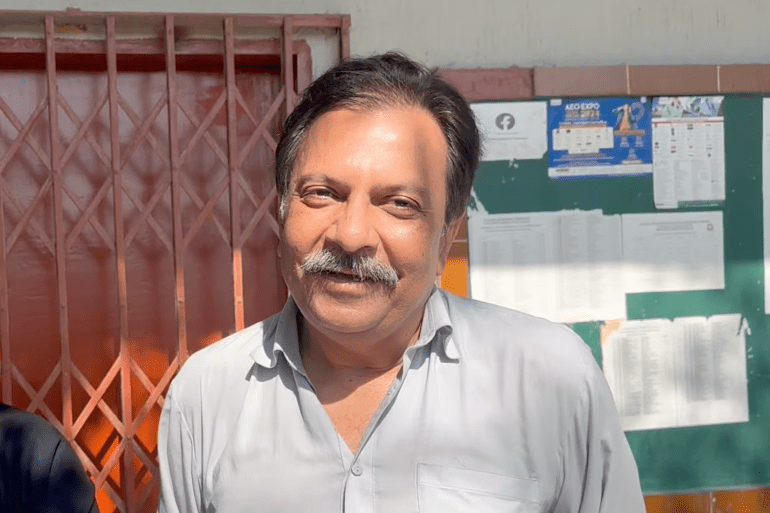Dr. Raza, a long-time voter at PECHS, who repeatedly complained to the election commission that his booth was not accessible for the elderly or those with disabilities. [Alia Chughtai/Al Jazeera]