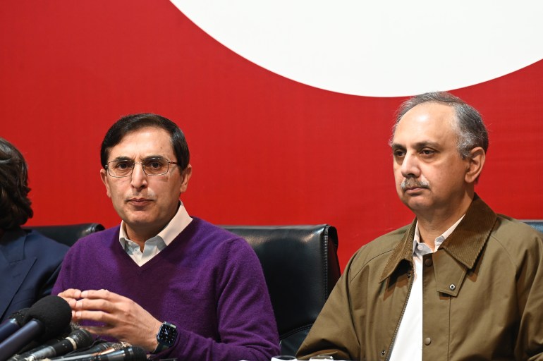 Omar Ayub Khan (right) is the a former federal minister with the Pakistan Tehreek-e-Insaf who is nominated as party's prime minister candidate. [Sohail Shahzad/EPA]
