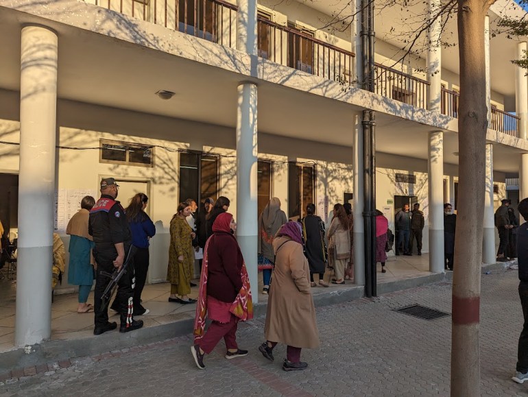Female voters lined up in NA 122 minutes before the end of polling time.  (Abed Hussein/Al Jazeera)