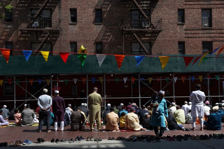Muslims attend the early afternoon Dhuhr prayers, as the Muslim fasting month of Ramadan nears to an end, along a street in the Queens borough of New York City, U.S., April 21, 2023. REUTERS/Shannon Stapleton