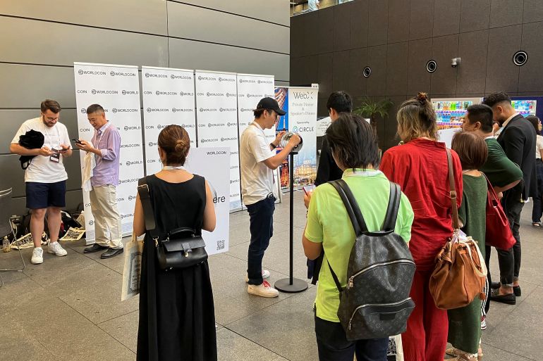 People queue to use WorldCoin's iris-scanners in Tokyo, Japan July 25, 2023