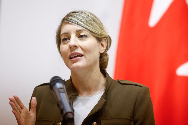 Canada's foreign affairs minister Melanie Joly speaks at a microphone