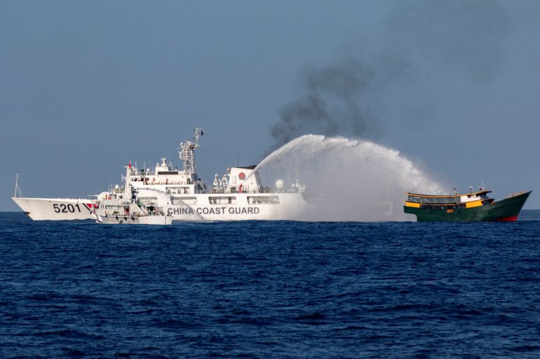 Chinese Coast Guard vessels fire water cannons towards a Philippine resupply vessel Unaizah May 4 on its way to a resupply mission at Second Thomas Shoal in the South China Sea, March 5, 2024.
