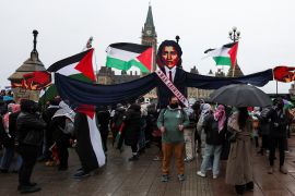 Protesters hold an effigy of Canada&rsquo;s Prime Minister Justin Trudeau during a rally to call for a ceasefire in Gaza, on Parliament Hill in Ottawa on March 9, 2024 [Ismail Shakil/Reuters]