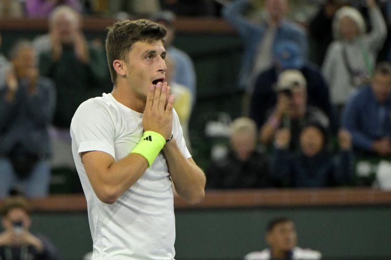 Mar 11, 2024; Indian Wells, CA, USA; Lucky looser Luca Nardi (ITA) reacts after defeating world number one Novak Djokovic (SRB) in the third round match in the BNP Paribas Open at the Indian Wells Tennis Garden. Mandatory Credit: Jayne Kamin-Oncea-USA TODAY Sports