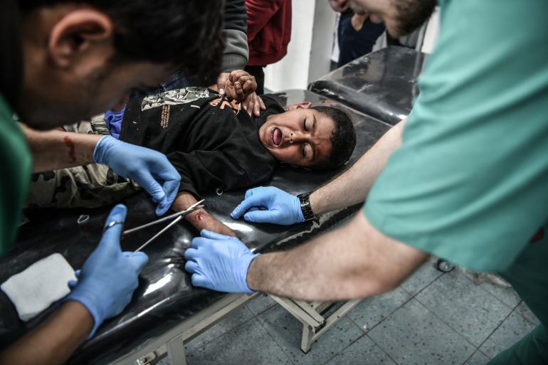 An injured Palestinian child receives medical treatment after being taken to Al-Emirati Hospital following Israeli attacks in Rafah, Gaza on March 02