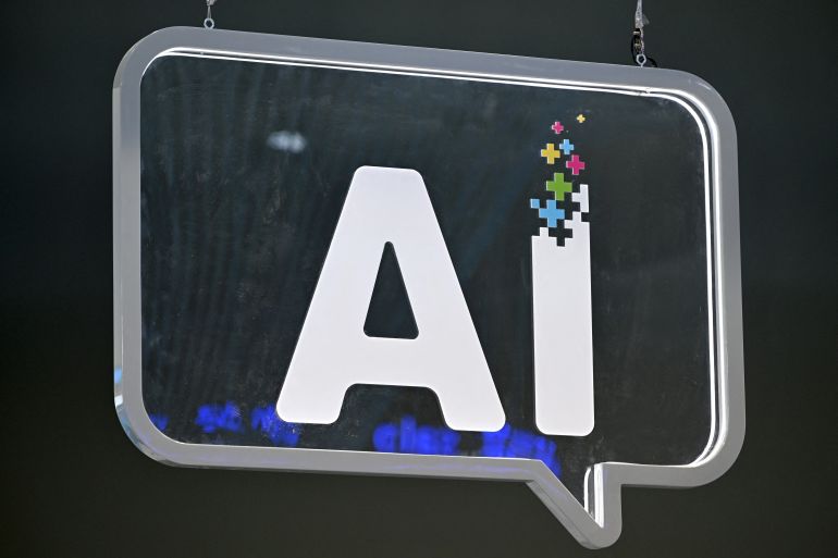 An AI (artificial intelligence) logo is pictured at the Mobile World Congress (MWC), the telecom industry's biggest annual gathering, in Barcelona on February 27, 2024. - The world's biggest mobile phone fair throws open its doors in Barcelona with the sector looking to artificial intelligence to try and reverse declining sales. (Photo by Josep LAGO / AFP)