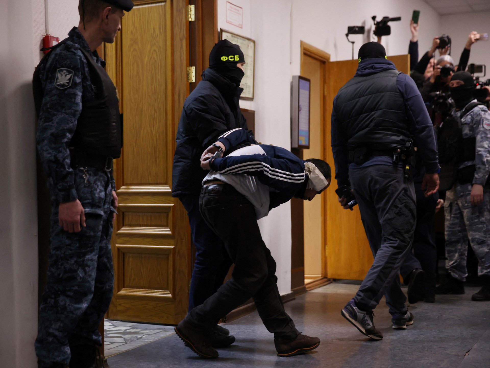 Four men showing signs of severe beating charged over Moscow concert attack  | ISIL/ISIS News | Al Jazeera