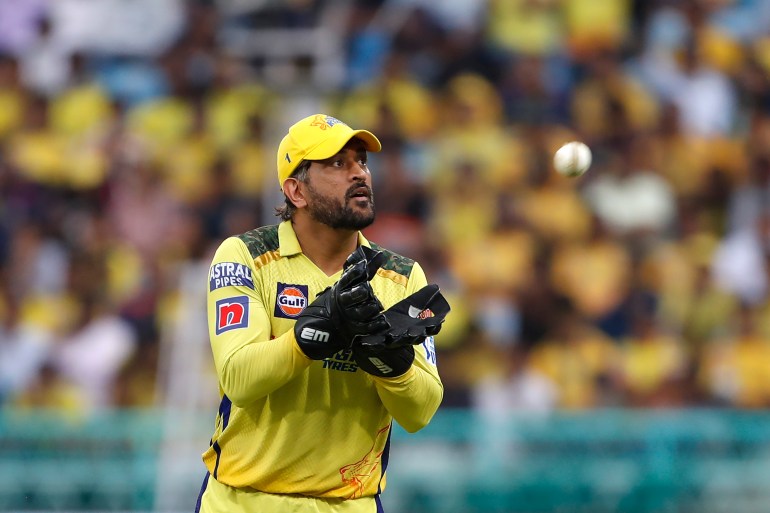 Chennai Super Kings captain Dhoni collects the ball during the Indian Premier League series.