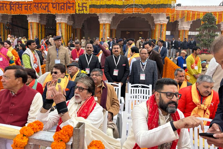Bollywood actor Amitabh Bachchan, center left with his son Abisheik Bachchan, center right along with other chief guests sit awaiting the opening of a temple dedicated to Hindu deity Lord Ram, in Ayodhya, India, Monday, Jan.22, 2024. Indian Prime Minister Narendra Modi is set to open a controversial Hindu temple built on the ruins of an ancient mosque in the holy city of Ayodhya in a grand event that is expected to galvanize Hindu voters months before a general election. (AP Photo/Rajesh Kumar Singh)