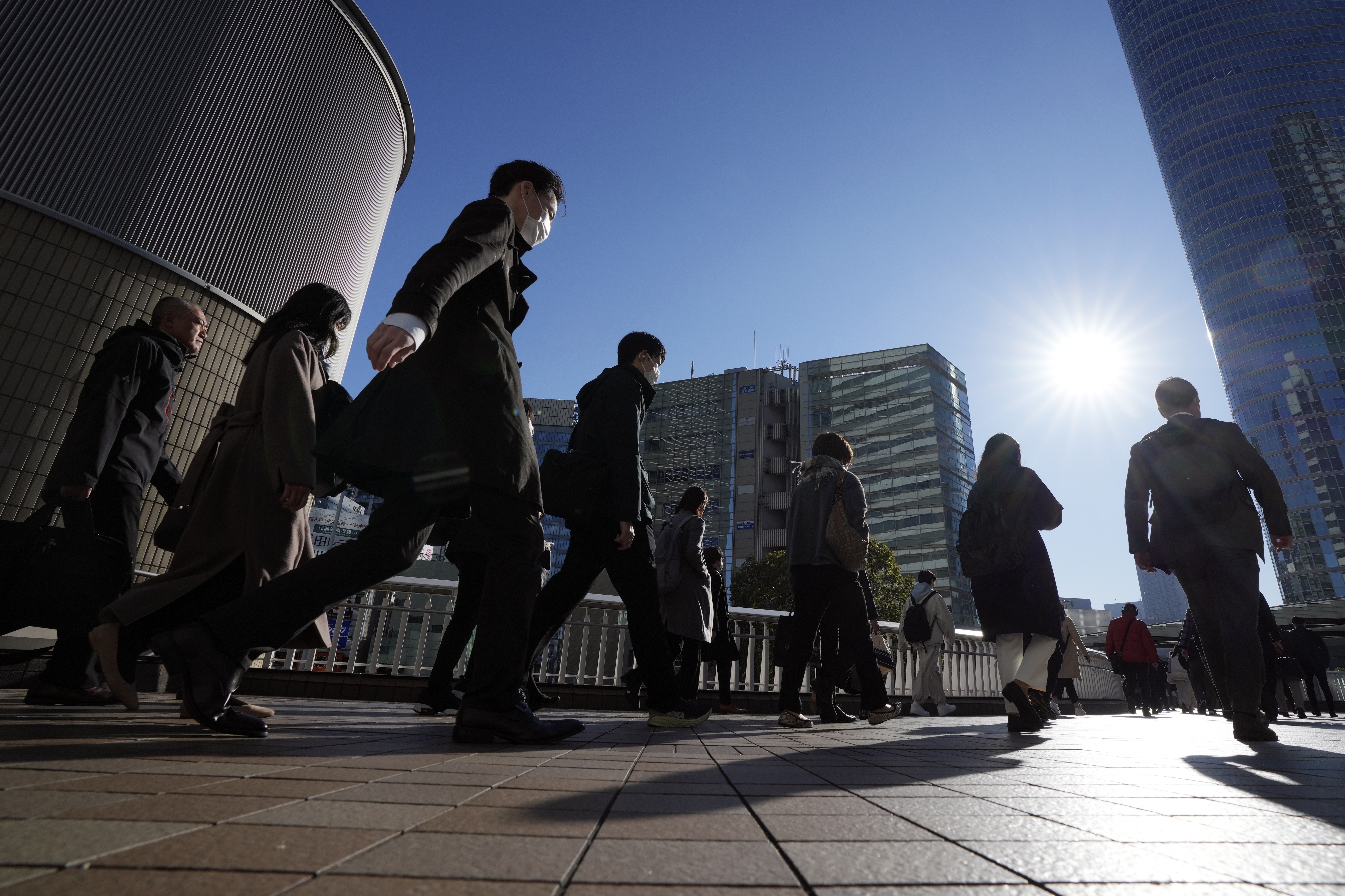 Japan’s economy narrowly escapes recession as growth figures are revised for the better