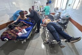 Palestinians wounded in an Israeli strike while waiting for humanitarian aid on the beach in Gaza City are treated in Shifa Hospital [Mahmoud Essa/AP Photo]