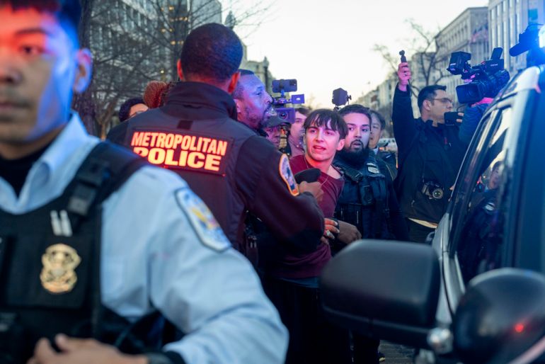 A man is arrested after driving his vehicle near protesters at a rally demanding a permanent ceasefire and end to U.S. funding to Israel near the White House on Wednesday, March 7, 2024 in Washington. (AP Photo/Kevin Wolf)