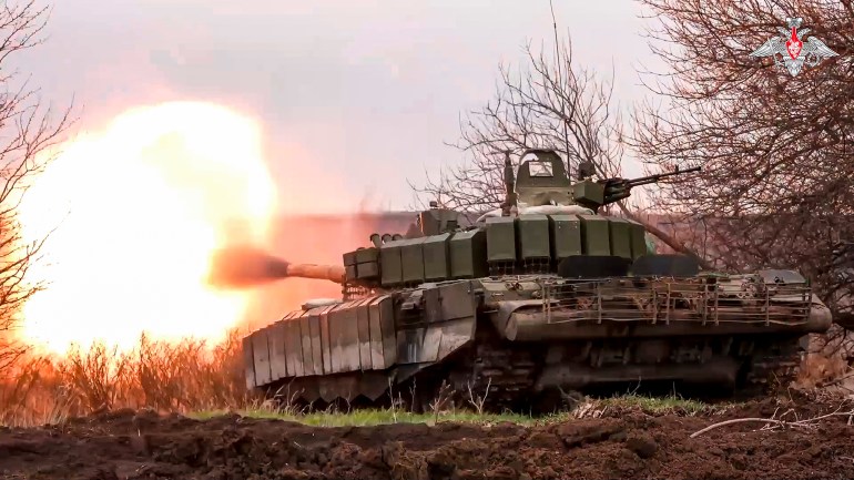 FILE - In this photo released by the Russian Defense Ministry Press Service on Tuesday, March 19, 2024, a Russian tank fires at Ukrainian troops from a position near the border with Ukraine in the Belgorod region of Russia. The Russian military says it has inflicted massive losses to Ukrainian forces who have launched cross-border raids into the region. (Russian Defense Ministry Press Service via AP, File)