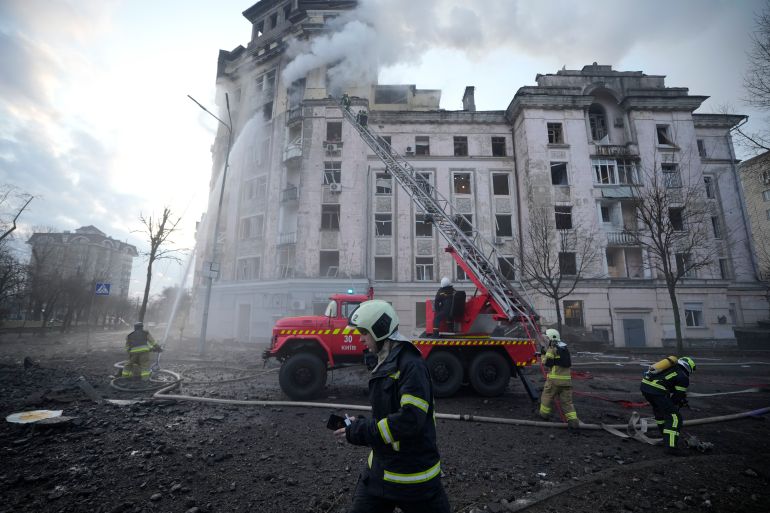 Firefighters work at the site after a Russian attack in Kyiv, Ukraine, Thursday, March 21, 2024. Around 30 cruise and ballistic missiles were shot down over Kyiv on Thursday morning, said Serhii Popko, the head of Kyiv City Administration. The missiles were entering Kyiv simultaneously from various directions in a first missile attack on the capital in 44 days. (AP Photo/Vadim Ghirda)