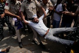 Policemen detain a member of Aam Admi Party, or Common Man&#039;s Party, during a protest against the arrest of their party leader Arvind Kejriwal in New Delhi, India, Tuesday, March 26, 2024. Indian police have detained dozens of opposition protesters and prevented them from marching to Prime Minister Narendra Modi&rsquo;s residence to demand the release of their leader and top elected official of New Delhi who was arrested on March 21. [AP Photo/Manish Swarup]