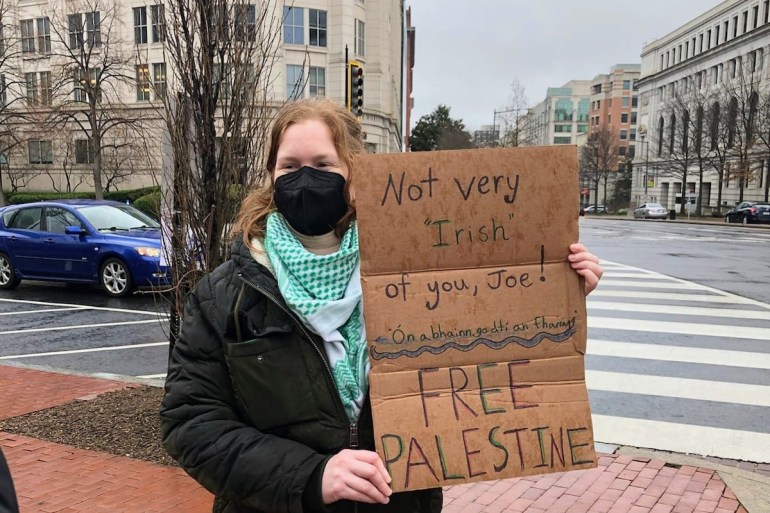Alison O'Connell, an American who plans to also apply for Irish citizenship, protests for Palestine during the St. Patrick's Day March in Washington D.C. [Delaney Nolan/Al Jazeera]