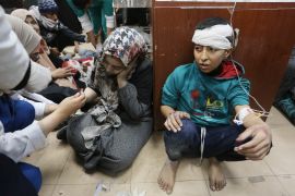 Palestinians injured in an Israeli attack on Nuseirat refugee camp